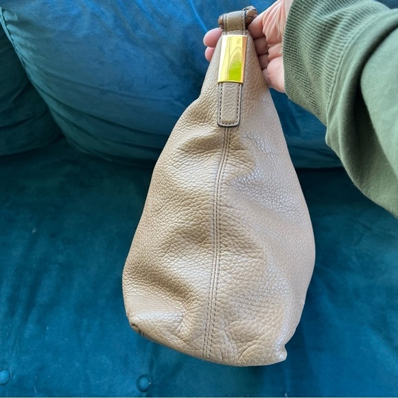 MICHAEL KORS COLLECTION
Skorpios Desert Tan Pebbled Leather Hobo
Bag $79… - Picture 10 of 16